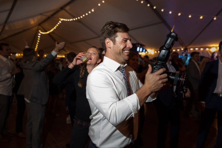 behind the scenes mountain wedding photographer wedding reception