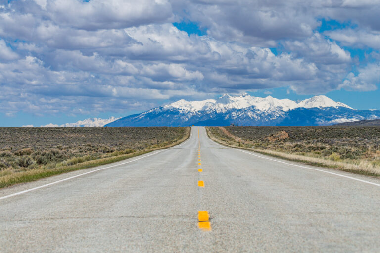 mountains at the end of an open road