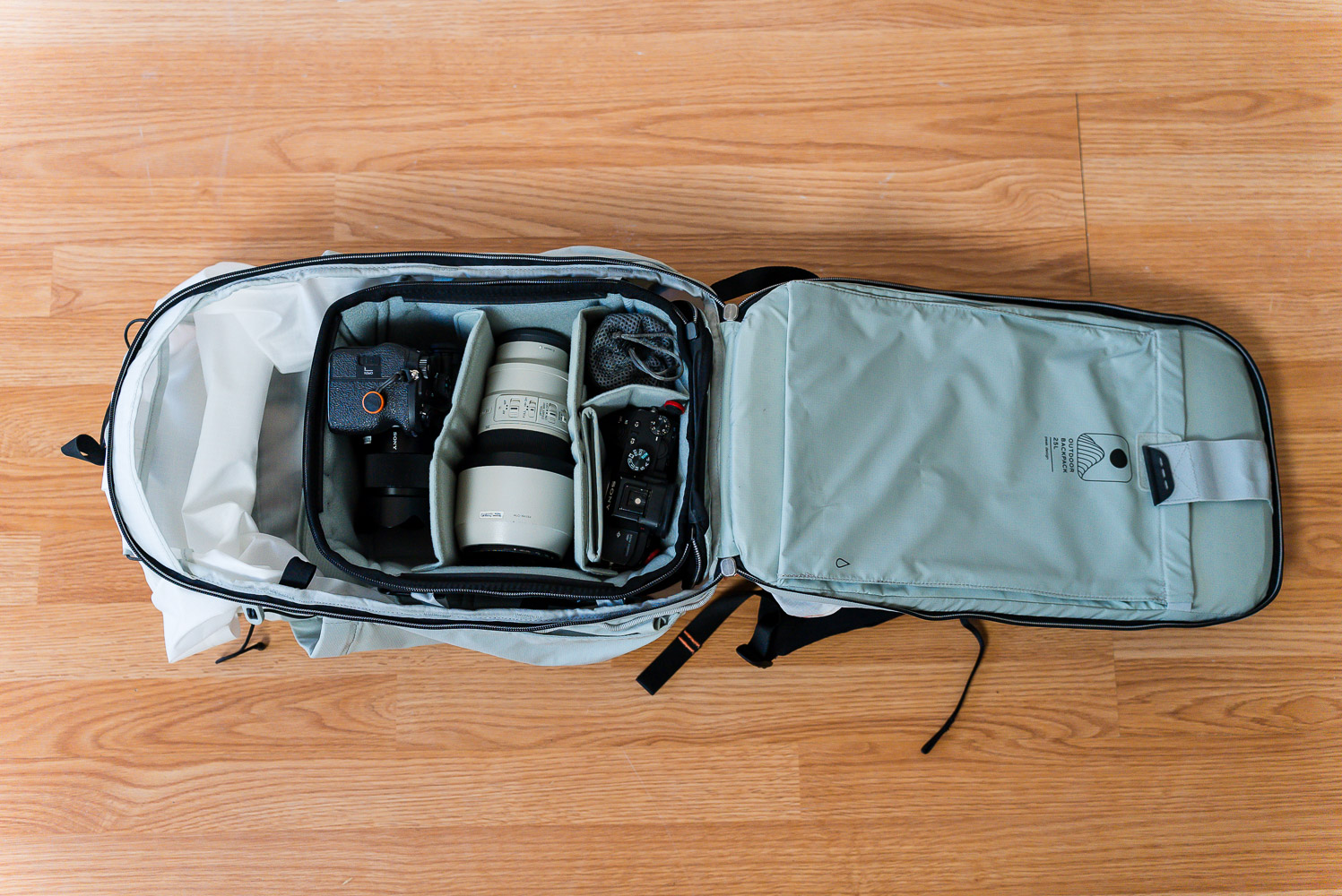 peak design outdoor backpack 25l flatlay with a smedium camera cube